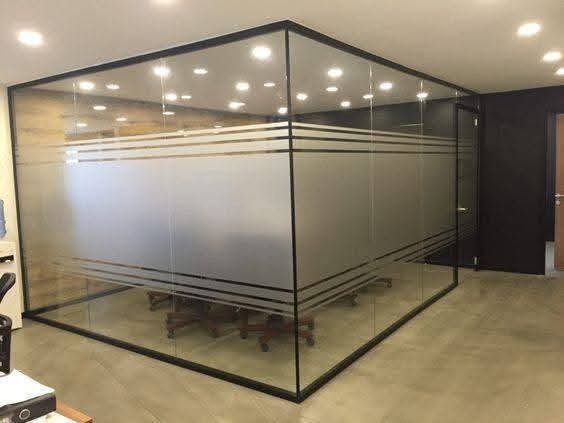 Modern office glass room with frosted privacy stripes