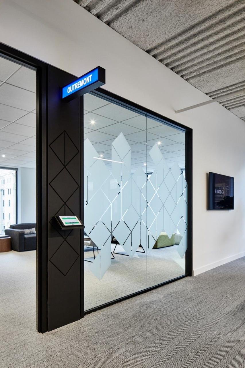 Office entrance glass with geometric frosted privacy shapes